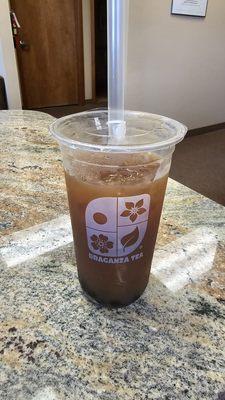 Black ice tea with boba.