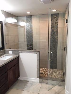 Large frameless shower enclosure install by the great crews from National Glass & Mirror.