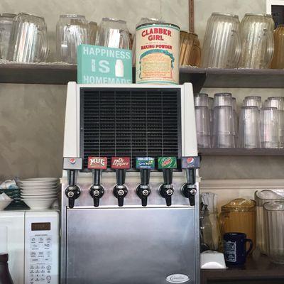 Look at this awesome, old school soda machine.