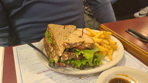 BLT on wheat bread and fries.