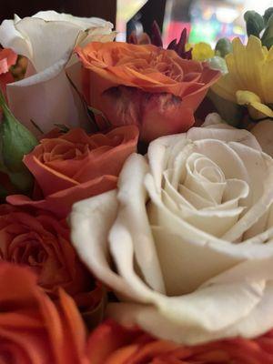 Wilted flowers and arrangement stuffed in the vase.  You should have HELPED him!!