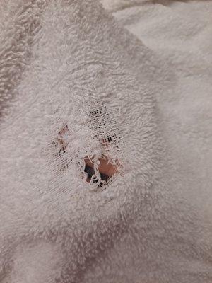 Hole in a bath towel.