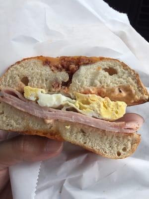 Signature egg, bacon, ham and cheese sandwich