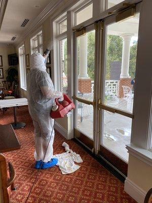 Applying EPA listed hospital grade disinfectant to a local country club surroundings