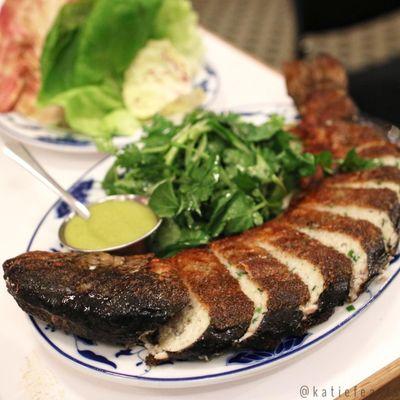 Deboned and stuffed rainbow trout with lettuce