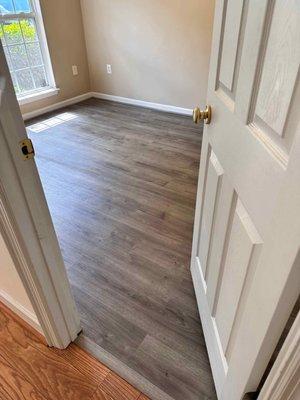 Transition. From hallway to bedroom with new flooring.