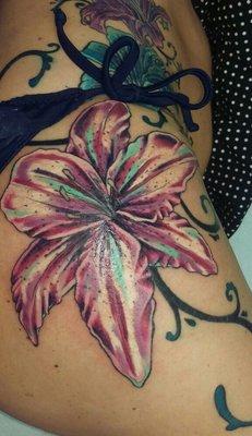 Large flower tattoo on hip. By Kat