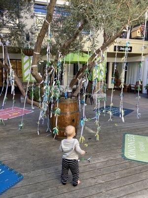 Cute tree they have during December 2020. You can tie peace, joy, and happiness onto the tree.