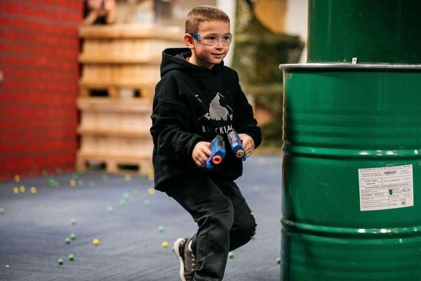 Quick feet, quicker wits! This sharpshooter darts through the arena, ready for action at Tactical Urban Combat!