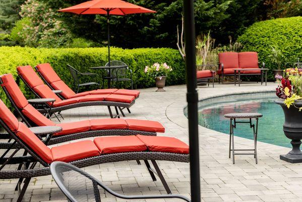 Our beautiful outdoor pool and relaxing lounge chairs