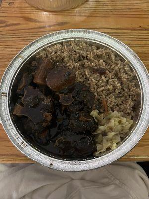 Oxtail with rice and peas and steamed cabbage