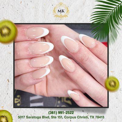 Effortless elegance: Keep it fresh and classy with white French nails, perfect for summer soirées and beachside strolls.