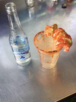 Sparkling water with cucumber, shrimp, lime and hot sauce