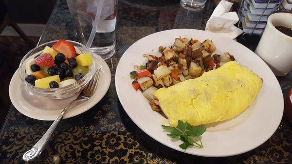 Corned Beef Omelette with potatoes and fruit bowl