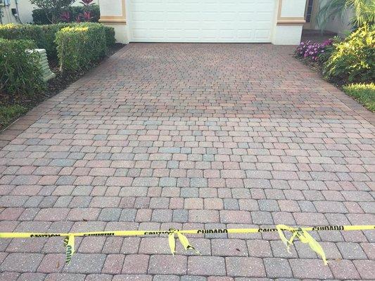 Power washed paver driveway. Half of it is sealed.