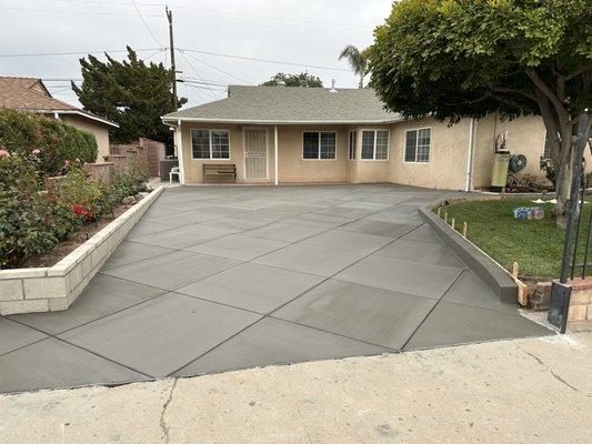 Complete demo to make way for a new driveway and planter wall.