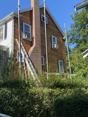 Removal of old vinyl siding at a project in Arlington