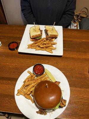 Pecan crusted chicken sandwich and tiger burger, both with fries.