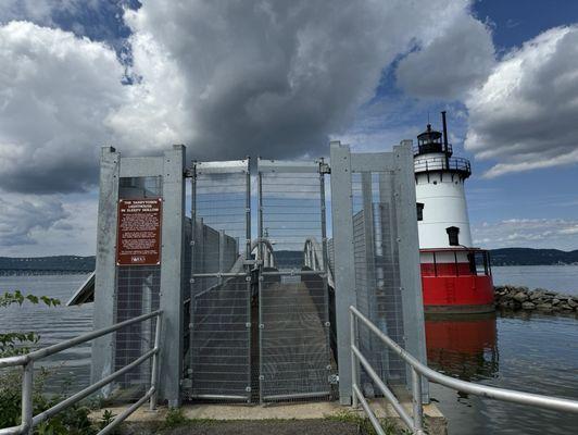 Lighthouse with sign advising when it'll be open to public again (end of 2024 it says).