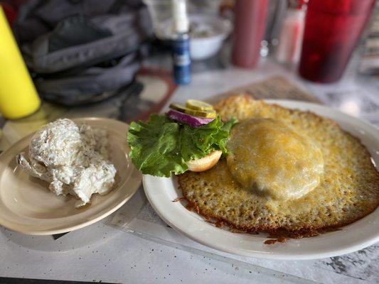 Volcano burger with a side of potato salad