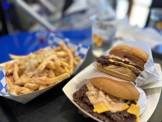 Double burger with screwed fries as shown. Perfect for two hungry adults. $31.86 after tax and tip (Dec 2023 prices)