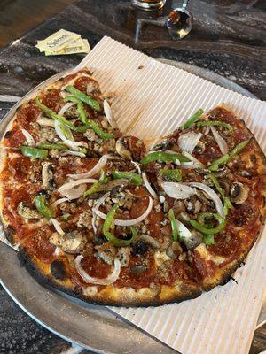 Works pizza with no olives and crispy. Crust was perfect and toppings (onions, peppers) still a bit crunchy. Perfect in our book!