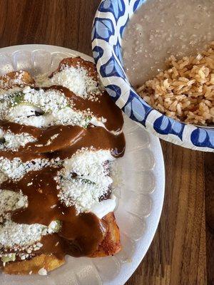 Chicken enchiladas rice and beans