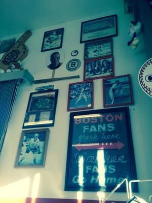 cool sports decor and pretty girls; must be quite the enjoyable haircut experience for the sandwich men!