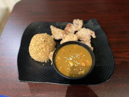 Chicken karage with a side of curry and fried rice