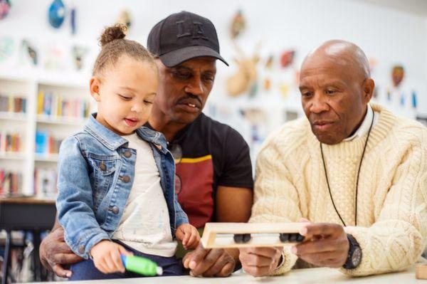 Grandad being taught how to use Dr Batie PhD Five Frame.