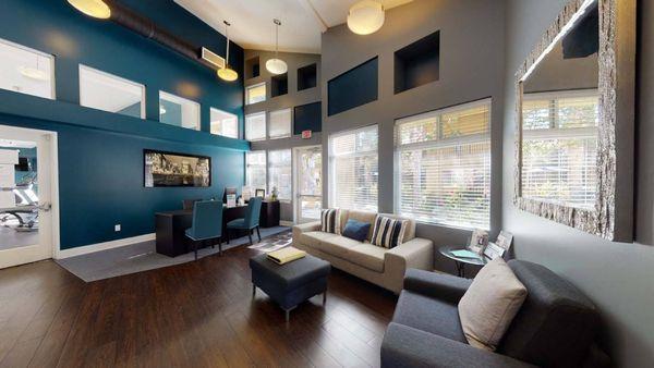 a living room with blue walls and a couch