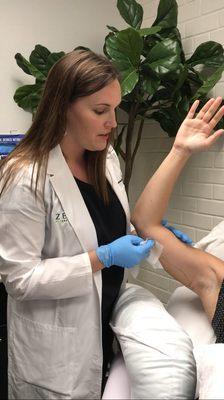 Preparing the arm for CoolSculpting to reduce unwanted fat