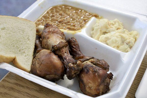 Chicken dinner with baked beans and potato salad