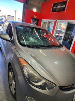 BEFORE - severely damaged windshield