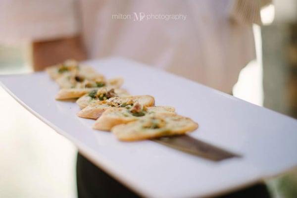 Crostini + Caramelized Maui Onion + Warm Goat Cheese + Macadamia Nuts + Honey Drizzle