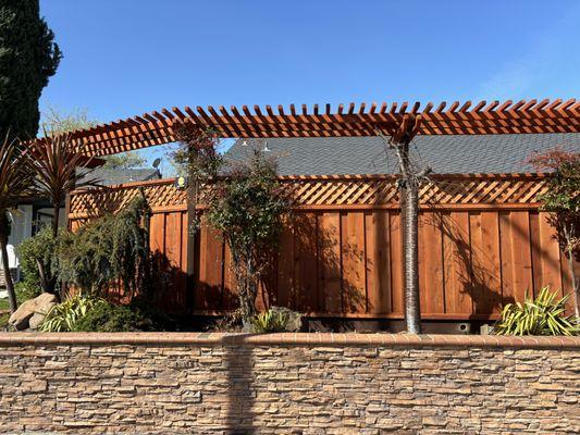 Arbor over board on board fence with privacy lattice. Sealed and protected on both sides.