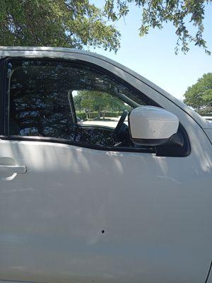 Road rage victims 45 caliber shot through the door glass and the door.