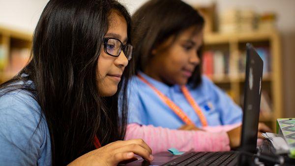 NYC Charter Schools Students Typing on a Laptop