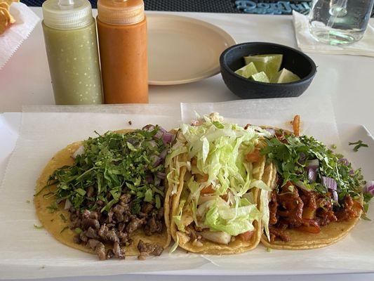 Left to right, steak, pascado, and Al pastor taco.  I liked them all, but White fish in a soy dressing with mayo, lettuce, and tomato.