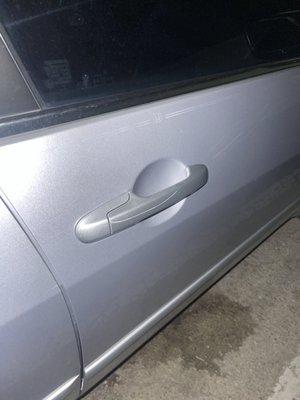 Very deep scratch from his key in my door handle