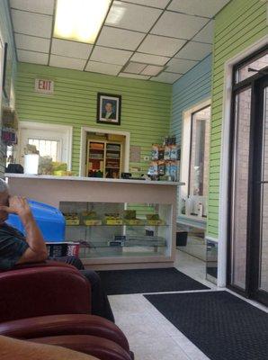 Inside the waiting room with about 15 accent chairs.