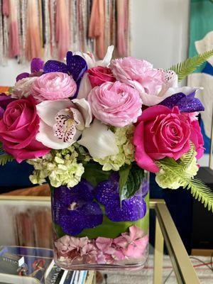 Bouquet of ranunculus, roses, orchids and lilies