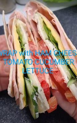 Wrap with ham cheese tomato cucumber lettuce