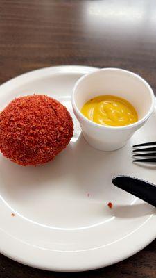 Birria cheese balls dusted with hot Cheetos