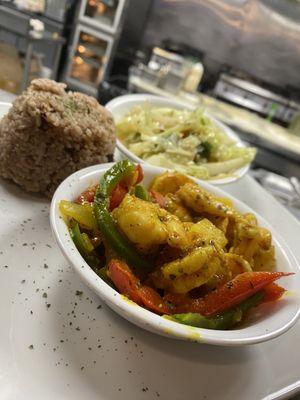 Our curry shrimp, served with rice n peas and cabbage