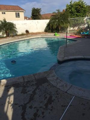 This is a 40 year old pool. The pool is crystal clear and dialed. An example of one of our service pools.