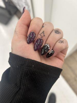 Perfect Black and Purple butterfly wing nail design!