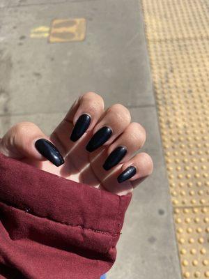 Black medium-long coffin nails.