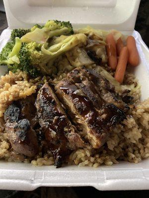 Teriyaki chicken with fried rice, steamed broccoli, and carrots