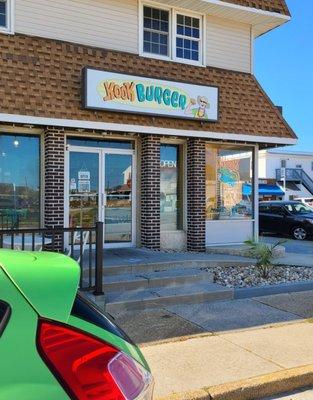 My colorful neon green car in front of colorful Kook Burgers !